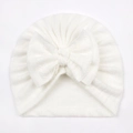 White ribbed knit baby turban hat featuring a large decorative bow for infants - One Size / White