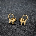 Minimalist gold cat stud earrings with long tails on textured dark gray background - Cat 1 / Gold