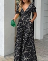 Detail of V-neck jumpsuit with abstract white pattern and pleated short sleeves - S / Black Printed