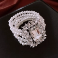 Detail of multi-strand pearl bracelet featuring a large sparkling crystal centerpiece - Multi-layer Pearl Bracelet / 33# Bracelet-Silver-6mm