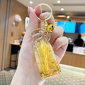Cartoon bear keychain with a golden mini glass bottle featuring wheat and glitter charms - Wheat-Tall Bottle
