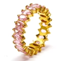 Macro detail of eternity ring with marquise-cut pink stones and 18k gold plating - Gold + Pink Zirconia