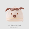 Dettaglio del berretto in maglia beige per neonati con orecchie e occhiali decorativi - 48cm 6 mesi-2 anni / Bianco Sporco