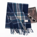 Blue plaid winter scarf with fringe and vintage label on a clean white background - Blue Plaid