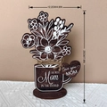 Detailed size view of wooden Mother's Day plaque measuring 20cm by 12.2cm on a desk - MZ804B / Brown