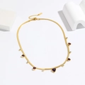 Gold snake chain necklace with purple heart gemstone and sparkling cubic zirconia tassels - Purple