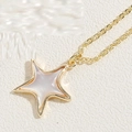 Macro shot of gold star necklace pendant with white mother of pearl inlay on leather - Resin Mother-of-Pearl Texture Star (XL2593-1)