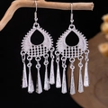Ethnic silver-plated tassel earrings featuring hollow leaf design and peacock style charms - Silver Teardrop Cone Tassel(E5774-3)