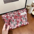 Pink brocade makeup bag with vintage floral patterns and woven textile texture - Vintage Red Rose