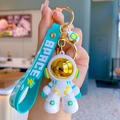 Blue astronaut keychain with SPACE silicone wrist strap and golden metallic lobster clasp - Green Large Astronaut (A0538)