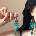 Detail of vintage bohemian shell tassel earrings with bronze hollow floral patterns - 4# Ear Hook - Lake Blue Cluster