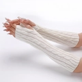 Close-up of white cable knit arm warmers showing soft wool texture and twist pattern - White