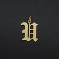 Macro view of a gold-plated stainless steel gothic letter H pendant with hanging ring - Letter U
