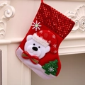 Christmas stocking with polar bear plush and red sequins hanging on white fireplace - Medium Bear Style