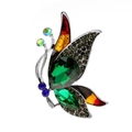 Elegant butterfly brooch with green crystals and enamel inlay on a white background - Malachite green