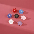 Set of seven colorful cherry blossom enamel pins in various vibrant pastel shades - White