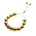 Detail of adjustable gold beaded bracelet featuring 4mm high polished metal round beads - 8mm Gold
