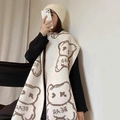 Cozy cream-colored knitted scarf featuring brown bear patterns and BEAR lettering design - Beige