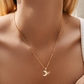 Elegant 18K gold chain necklace with a shell moon and crystal butterfly pendant on model - KN0450-Moon Butterfly Combo