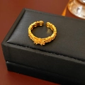 Macro view of vintage gold bow ring with beaded texture on a black jewelry box edge - Gold Bowknot (Real Gold Plated)