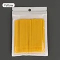 Confezione da 100 micro spazzole gialle per extension ciglia con manico in plastica - Giallo