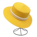 Close-up of yellow straw sun hat with elegant pearl and gold chain decorative band - Artificial Pearl Gold Chain Style (299F)