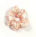 Detailed view of pink satin Easter scrunchie with cute cartoon bunny and floral patterns - Pink Bunny Head