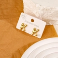 Minimalist gold-plated stainless steel stud earrings featuring the uppercase letter K - Letter K
