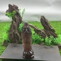 Deep purple brown natural semi-precious stone Mary crystal statue on a wooden base - Strawberry Quartz