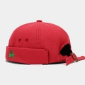 Detail of red Miki Hat featuring green clover embroidery and bronze metal adjustment buckle - Adjustable / Red
