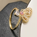 Detailed macro view of gold butterfly ring with pearl accents and evil eye enamel - 13172 / Pink Eye