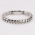Detailed view of silver stainless steel Cuban link bracelet on a display stand - 12mm / Silver
