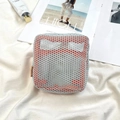 Detail of square mesh cosmetic bag with orange lining and brand tag on white fabric - Light Blue/Orange