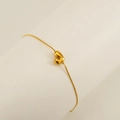 Golden chain bracelet featuring a polished 3D puffy letter J pendant on a white stand - Letter J