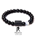 Detailed view of Aquarius black obsidian bracelet with frosted zodiac cylinder bead - Aquarius