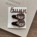 Pair of plush sheep hair clips with imitation pearl accents on white Bunny card - Coffee Sheep Snap Clip