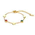 Close-up of 18K gold stainless steel heart bracelet with red and green gemstones - Gold Heart Gemstone Bracelet