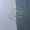 Macro detail of 5D embossed nail stickers with yellow tulips and 3D white bows - Yellow Tulip Pearl Frame Style (FEB-477)