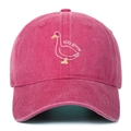 Close-up of the silly goose embroidery on a vintage washed pink cotton baseball cap - Rose Red