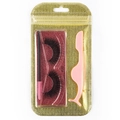 Detail view of 3D dense false eyelashes #107 with pink tweezers and brush in gold pouch - Gold Bag #107