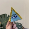 Dreieckige Haarklammer aus Acetat mit blauem Auge-Symbol und goldenem Vintage-Rahmen-Design - Gelbe Bordüre Dreieckiges Auge