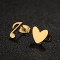 Asymmetric gold heart and music note stud earrings on textured black surface - 678 Gold (Heart & Note)