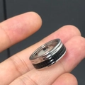 Detail view of silver ring with black square pattern and ERON 57 inner engraving - Style 19