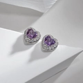 Macro shot of purple heart-shaped ruby stud earrings with pavé white diamond halo - Heart Shape Purple Red Zirconia Studs