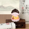 Cute panda monk figurine sitting on a pink lotus base with Zen traditional backdrop - B161 Lucky Buddha
