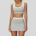 Women's light grey ribbed yoga set with white trim featuring cropped top and mini skirt - S / Top And Bottom / Clay Grey