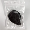 Biodegradable black konjac cleansing sponge packaged in a transparent zip bag - Black Teardrop