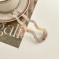 Detail of acetate U-shaped hair pin with marble texture and single rhinestone - Phantom Pink