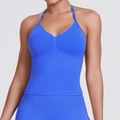 Close-up of royal blue seamless sports bra featuring halter neck and ruched chest detail - Electric Blue