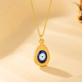 Goldene Edelstahlkette mit einem blauen Evil Eye Anhänger in Wassertropfenform an feiner Kette - Gold